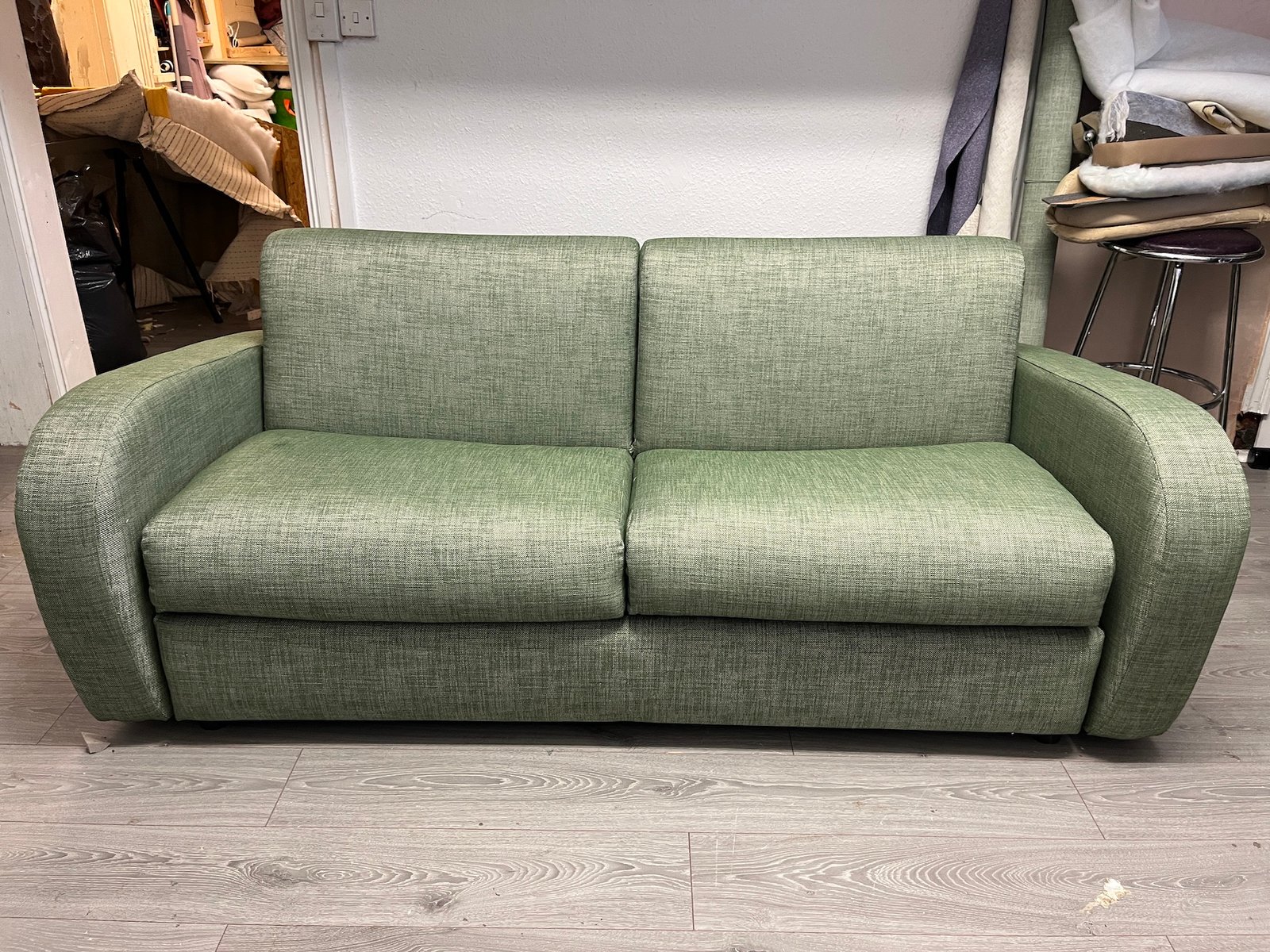 Olive green modern two-seat sofa with square arms