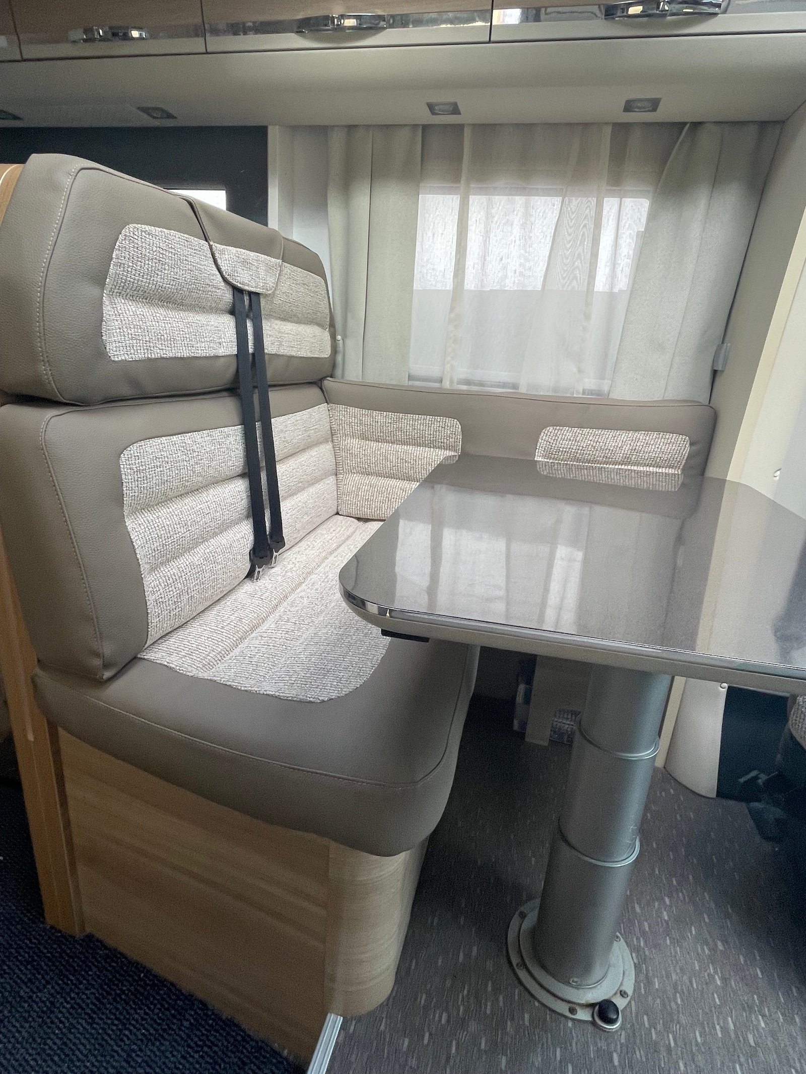 Camper interior with grey bench seat