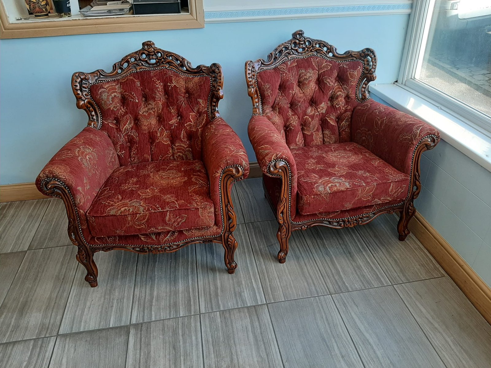 Pair of red antique carved armchairs