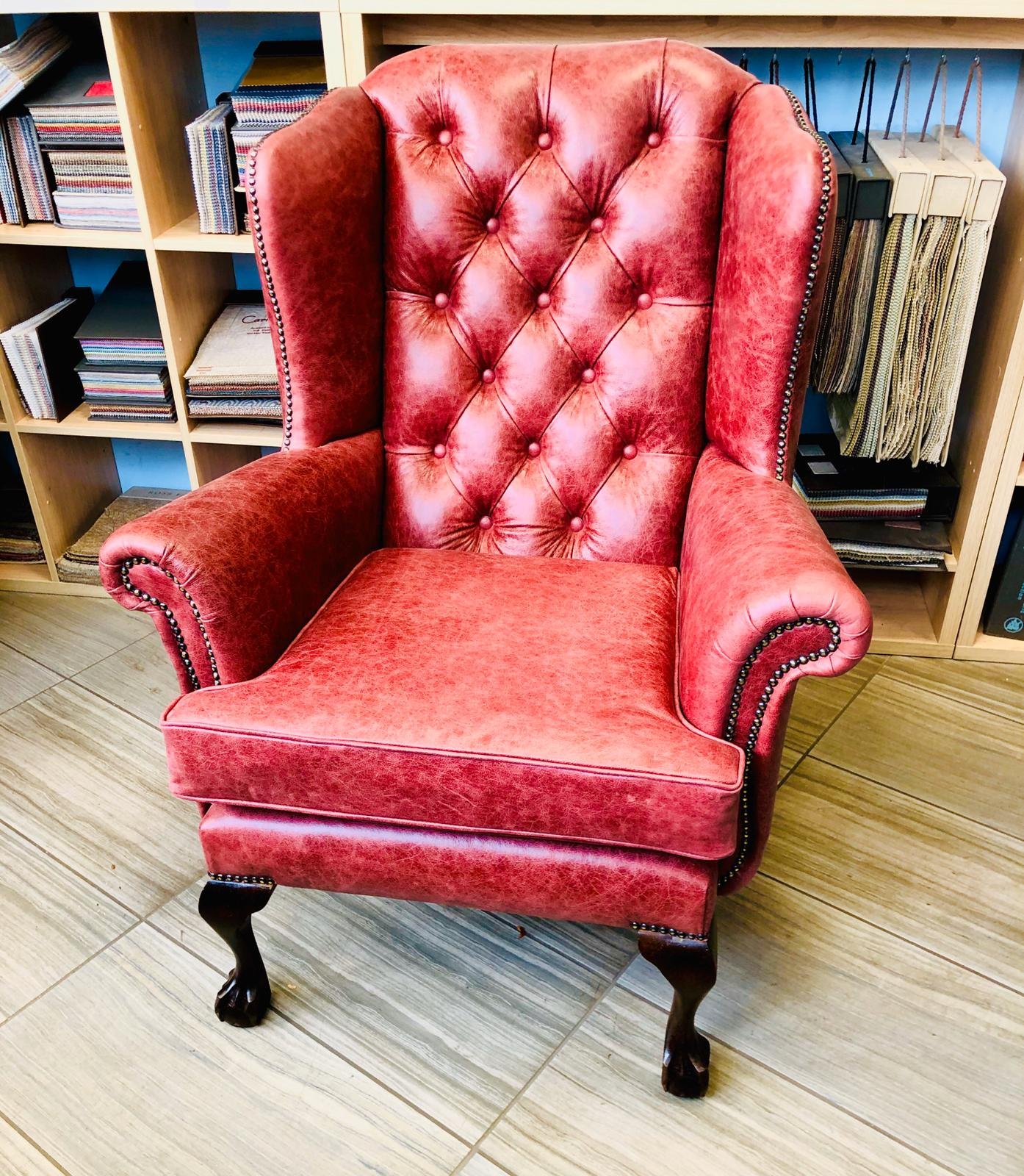 Red buttoned wingback chair