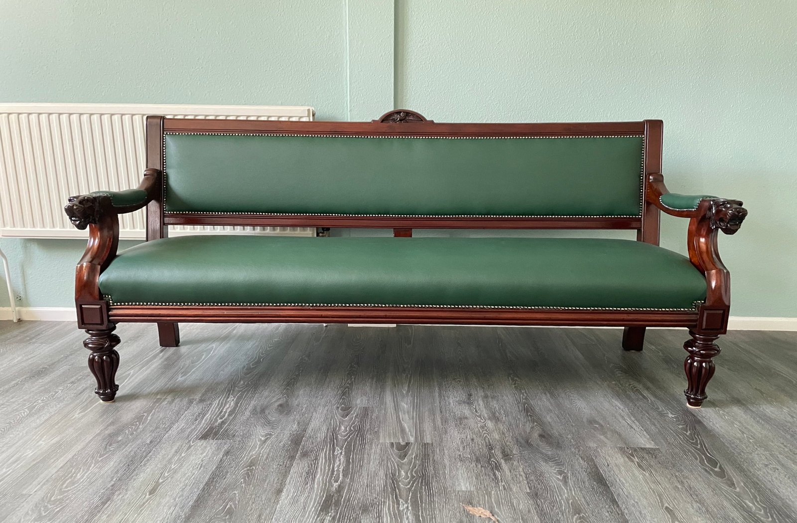 Green antique wooden-frame bench or settee