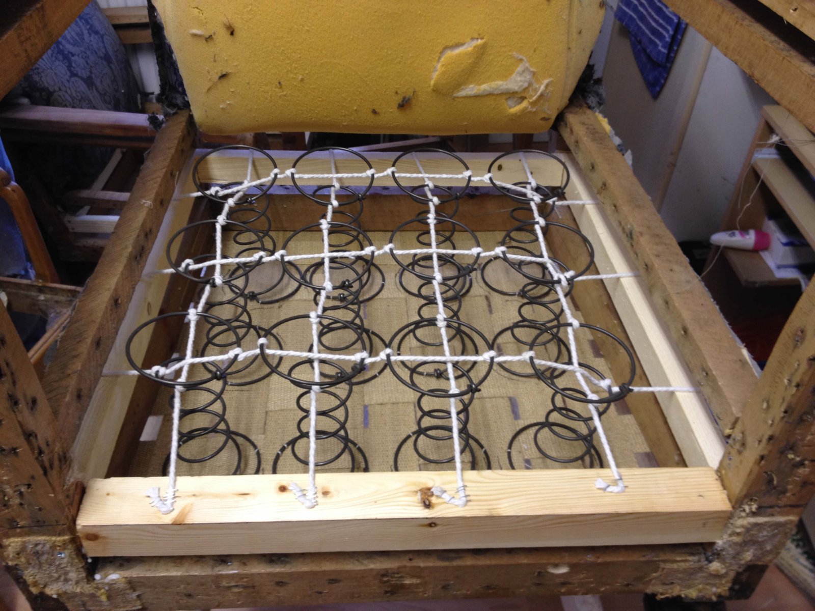 Spring unit and webbing inside a furniture frame