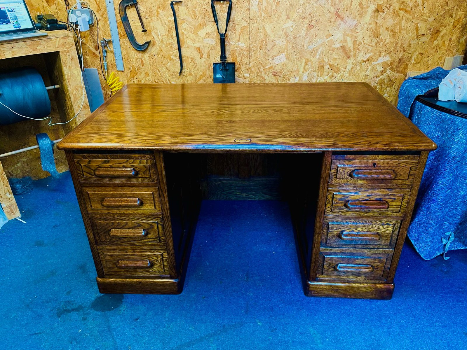 Large wooden pedestal desk after restoration